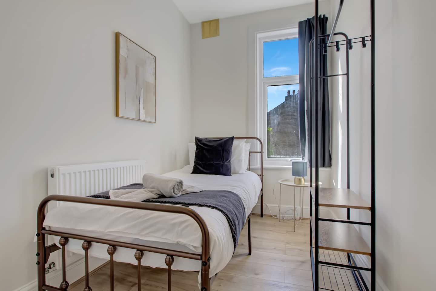 Bedroom three with a single bed