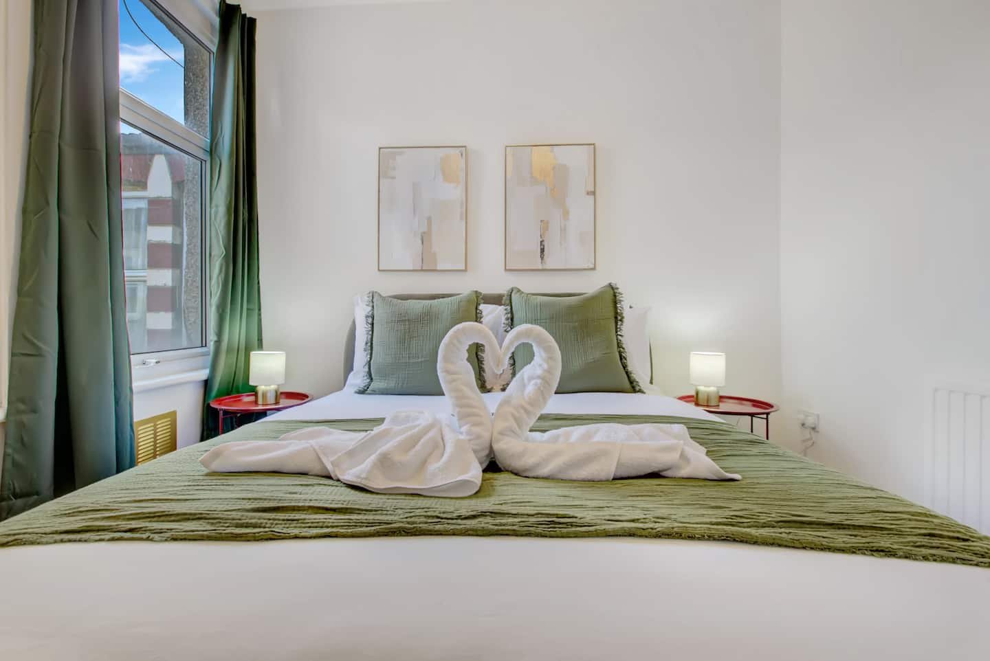 Bedroom with velvet bed frame at the Manor Park town house